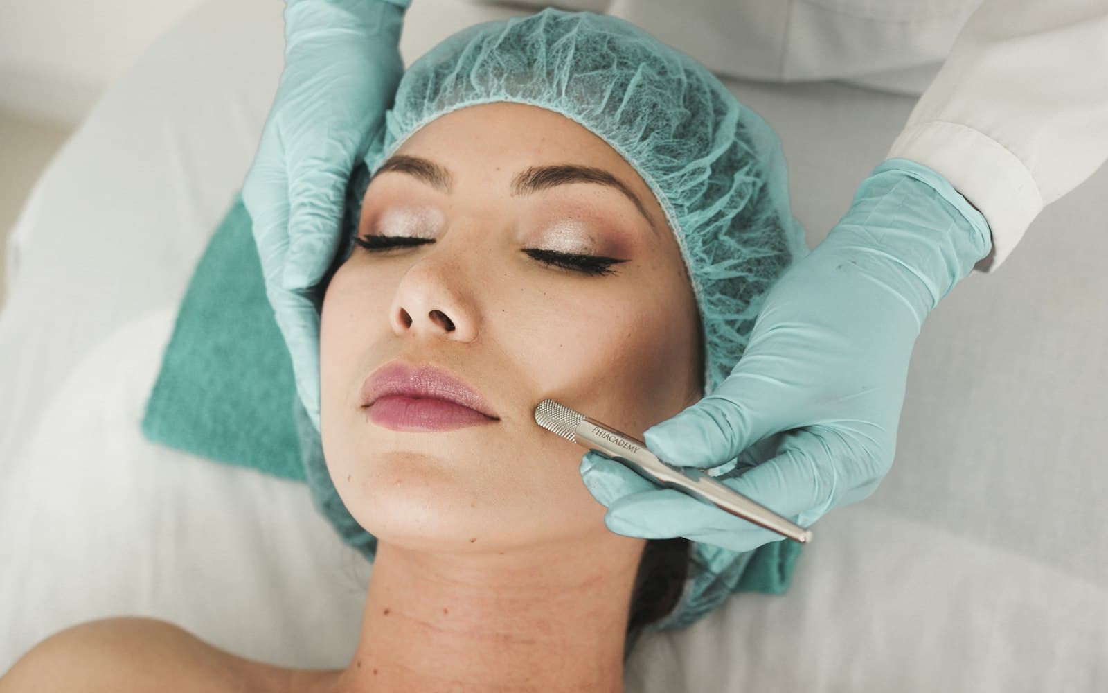 Practitioner performing a facial skin treatment in a clinic