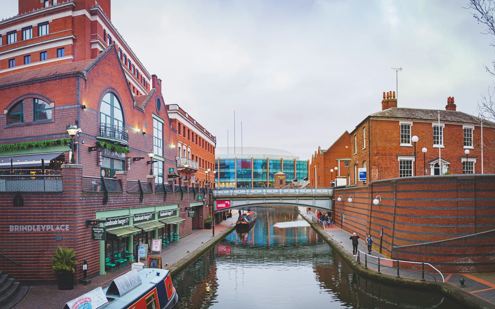 Birmingham canal lined with red-brick buildings
